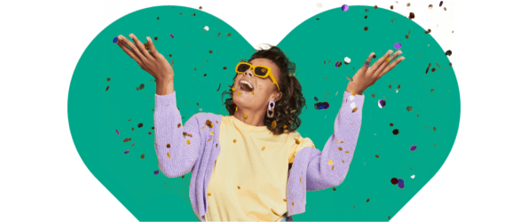 Woman throwing confetti in the air smiling with heart background